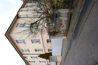 an overhead view of an apartment building with trees at Pravouhla in Prague