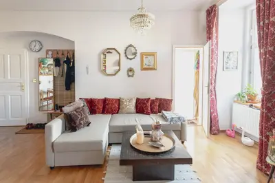a living room with a couch and a table at Victoria Design Stays - Apartment Rehorova in Prague