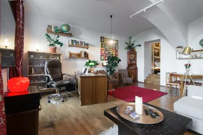 a living room with a desk and a chair at Victoria Design Stays - Apartment Rehorova in Prague