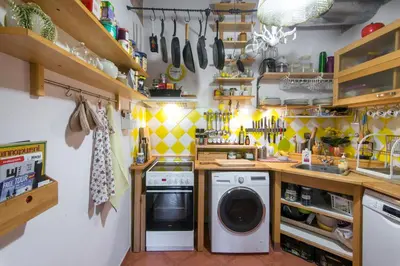 a laundry room with a washer and dryer at Victoria Design Stays - Apartment Rehorova in Prague