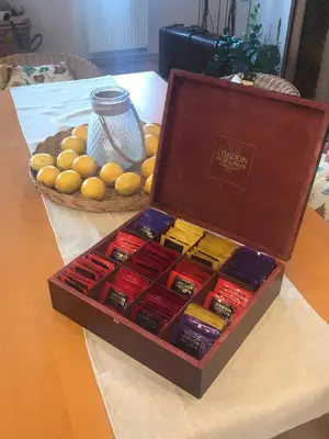a box full of different types of cigars on a table at Apartment Neratovice in Neratovice