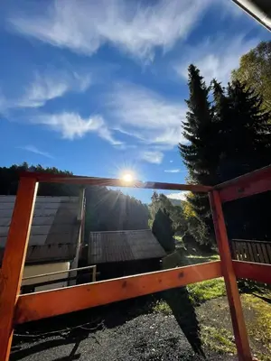 a view of the mountains from the porch of a house at Penzion Pod Houskou in Blatce