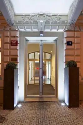 an entrance to a building with a glass door at Red & Blue Design Hotel Prague in Prague