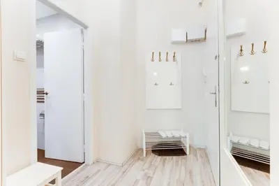 a dressing room with white walls and mirrors at Apartment Masná 21 in Prague