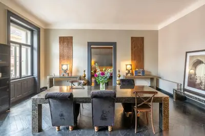 a dining room with a table and chairs at Masná - Old Town Residence in Prague