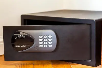 a black microwave oven sitting on top of a table at Masná - Old Town Residence in Prague