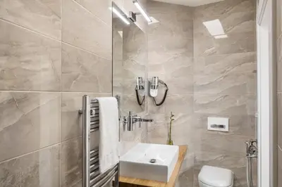 a bathroom with a sink and a toilet at Templova Old Town Apartment in Prague