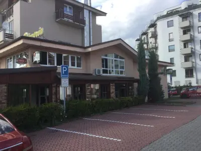 a parking lot in front of a building at Sunny Two-story Apartment Kyje in Prague