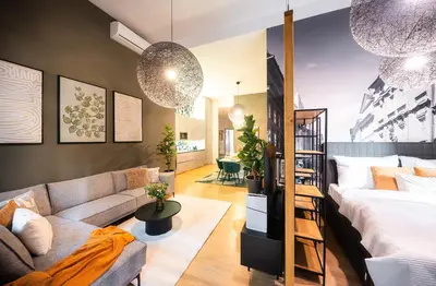 a living room with a bed and a couch at Billionaires Boutique Residence & Premium Suites, Old Town in Prague