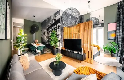a living room with a couch and a fireplace at Billionaires Boutique Residence & Premium Suites, Old Town in Prague