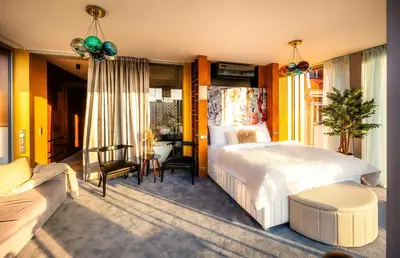 a bedroom with a bed and a desk and a couch at Billionaires Boutique Residence & Premium Suites, Old Town in Prague
