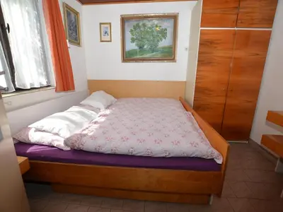 a small bedroom with a bed in a room at Outdoor Adventure & Relaxation in Svinařov