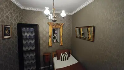a bedroom with a bed and a chandelier at St. Terezie - Baroque Residence in Prague