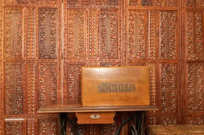 a wooden wall with a bench with the word smiles on it at St. Terezie - Baroque Residence in Prague