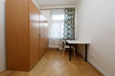 an empty room with a desk and a window at Apartment Lublanska 48 in Prague