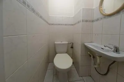 a bathroom with a toilet and a sink at Apartment Lublanska 48 in Prague