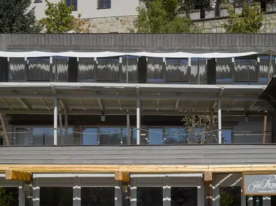 a building with windows and an awning on it at Hotel La Romantica in Mladá Boleslav