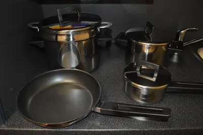 two pots and pans sitting on a kitchen counter at Valentina Apartments in Prague