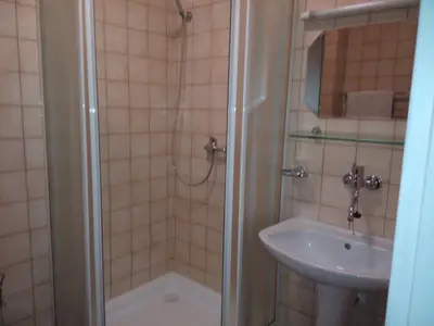 a bathroom with a shower and a sink at Hotel BESTAR in Mladá Boleslav