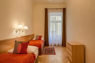 a hotel room with two beds and a window at Apartments 39 Wenceslas Square in Prague