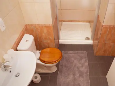 a small bathroom with a toilet and a sink at Apartment Sense of Zizkov in Prague