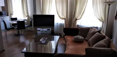 a living room with a couch and a coffee table at Kasablanka apartments in Prague