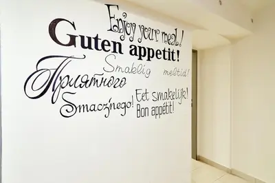 a wall with writing on it in a hallway at Kasablanka apartments in Prague