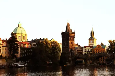 a city with a bridge over a river and buildings at Prague Studio Old Town in Prague