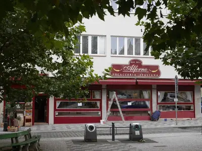 a restaurant with a sign on the front of it at Prague Studio Old Town in Prague