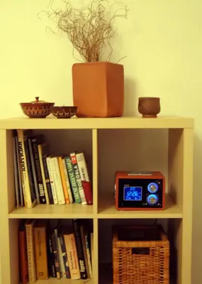 a book shelf with a clock on top of it at Prague Studio Old Town in Prague