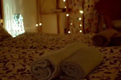 a towel laying on top of a bed at Prague Studio Old Town in Prague