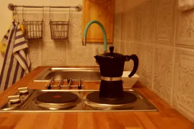 a tea kettle sitting on top of a stove at Prague Studio Old Town in Prague