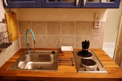 a kitchen with a sink and a stove at Prague Studio Old Town in Prague