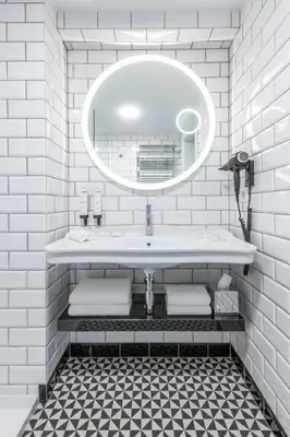 a white bathroom with a sink and a mirror at Mamma´s Boutique Hotel in Poděbrady