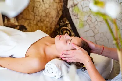 a woman laying on a bed with her eyes closed at Mamma´s Boutique Hotel in Poděbrady