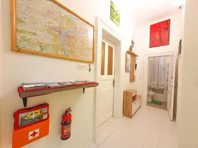 a hallway with a map on the wall next to a door at Apartment in the center of Prague in Prague