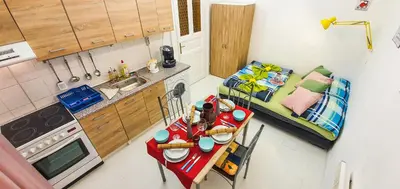 a small kitchen with a table and a couch at Apartment in the center of Prague in Prague