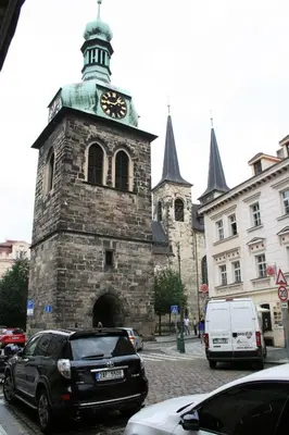 an old building with a clock tower on a street at The Republic Apartments in Prague