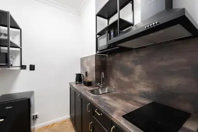 a kitchen with a sink and a counter top at Crystal Apartment in Prague