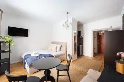 a living room with a couch and a table at Crystal Apartment in Prague