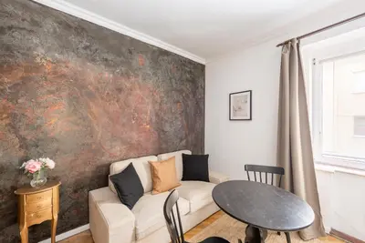 a living room with a couch and a table at Crystal Apartment in Prague