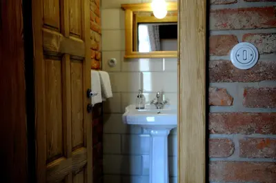 a bathroom with a white sink and a mirror at Starý Svět in Wotitz