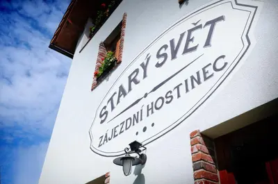 a street sign on the side of a building at Starý Svět in Wotitz