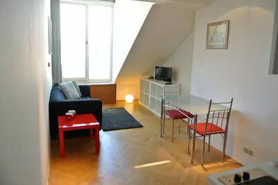 a living room with a couch and a table at Prague Letna Apartments in Prague