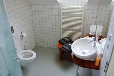 a bathroom with a sink and a toilet at Prague Letna Apartments in Prague