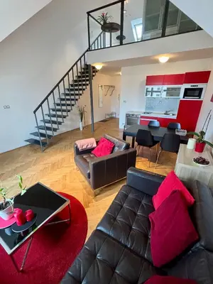 a living room with a couch and a table at Prague Letna Apartments in Prague