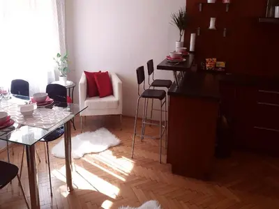 a living room with a glass table and chairs at Family Flat 120m2, Praha 2 Vinohrady in Prague