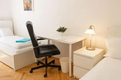 a room with a desk and a chair and a bed at Apartments with 2 Bathrooms- 5 minutes from Old Town - 102 m2 in Prague