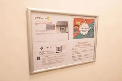 a bulletin board on a wall with a sign on it at Apartments with 2 Bathrooms- 5 minutes from Old Town - 102 m2 in Prague