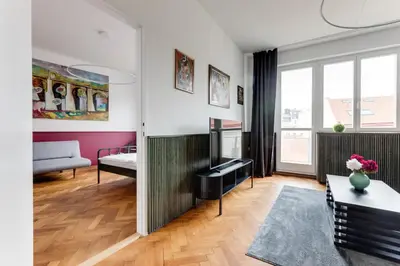 a living room with a couch and a table at Apartment Petrska in Prague